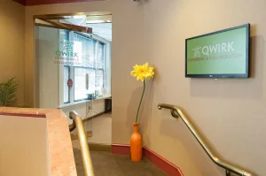 Professional booking a meeting room online in a modern coworking space